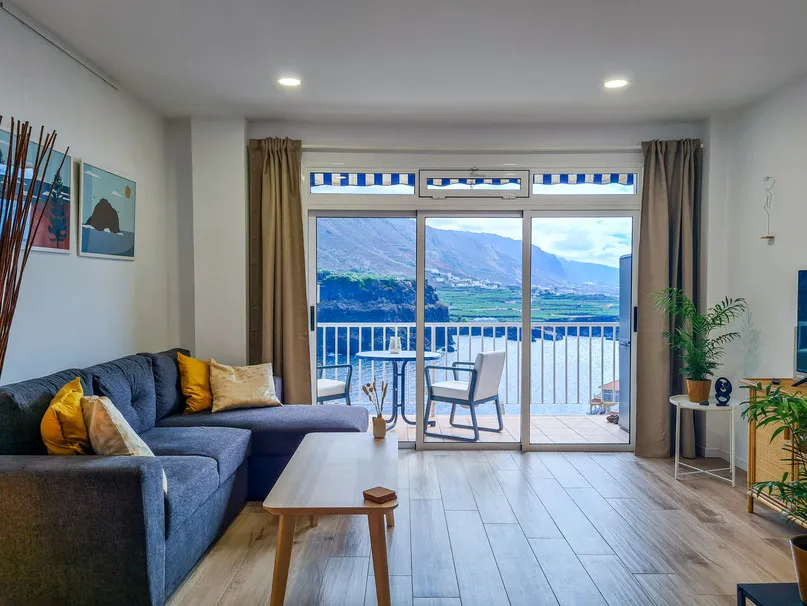 Living area opening onto the balcony, with ocean view